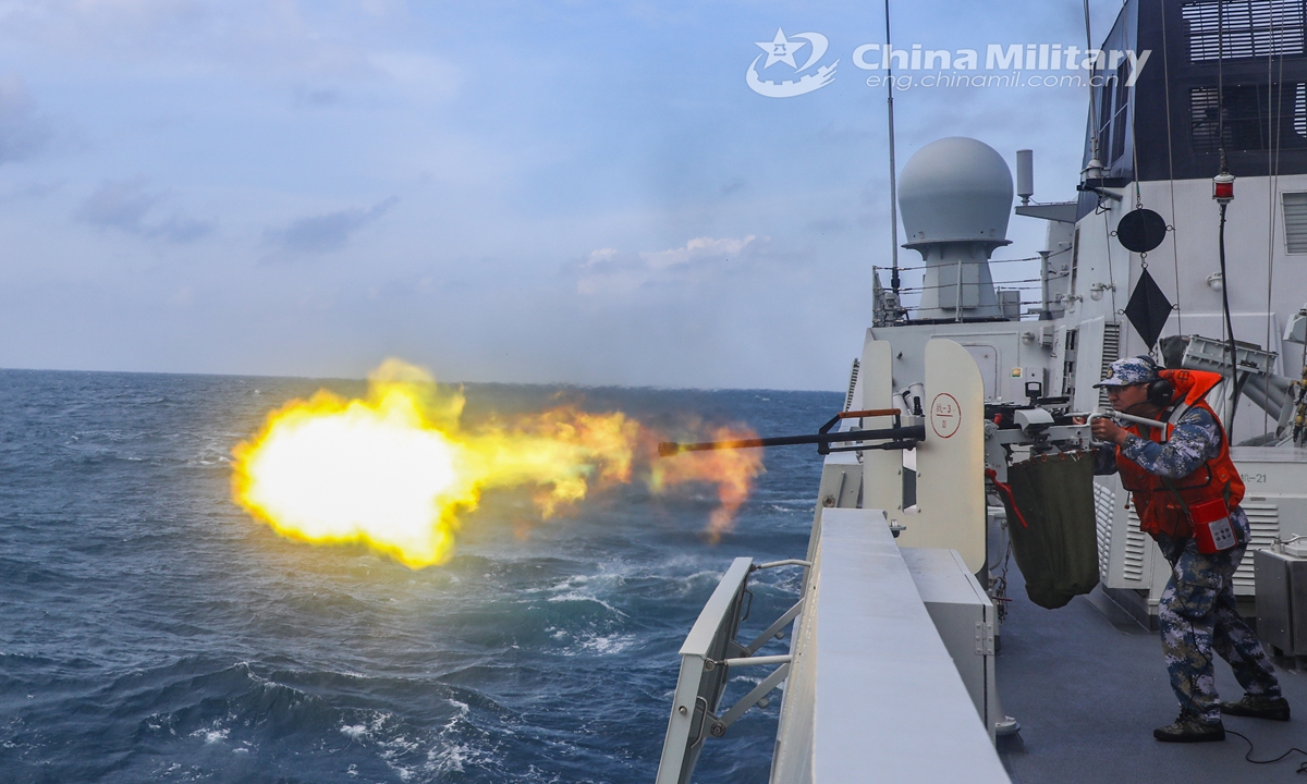 A sailor assigned to a frigate flotilla with the navy under the PLA Southern Theater Command fires heavy machine gun at a mock sea target aboard the guided-missile frigate Enshi (Hull 627) during a maritime training exercise in late November, 2021.Photo:China Military