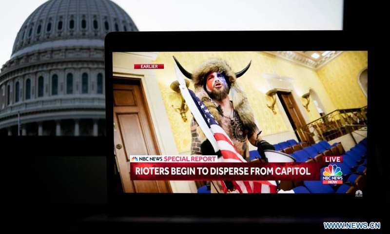 A protester breaking into the US Capitol building is captured on a screenshot in a video feed from NBC news seen in Arlington, Virginia, the United States, Jan 6, 2021.Photo:Xinhua