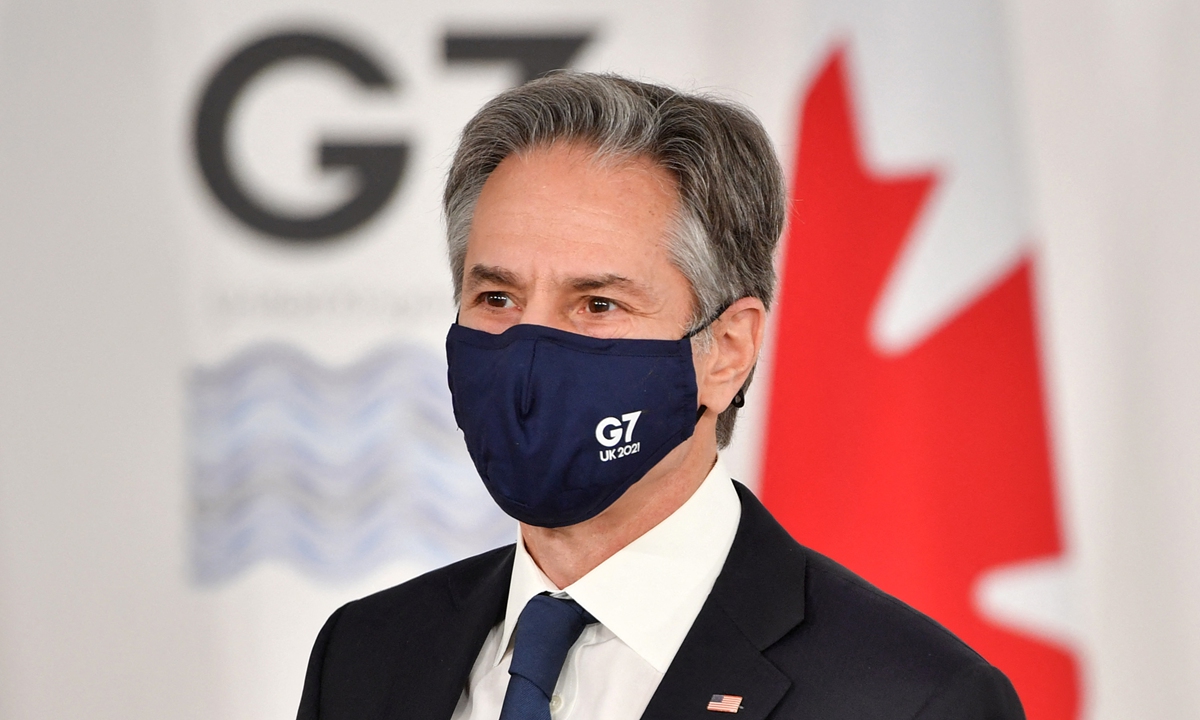 US Secretary of State Antony Blinken, wearing a mask, arrives for a G7 Foreign and Development Ministers Session with Guest Countries and Association of Southeast Asian Nations member states on the final day of the G7 foreign ministers summit in Liverpool, England, on December 12, 2021. Photo: AFP 
