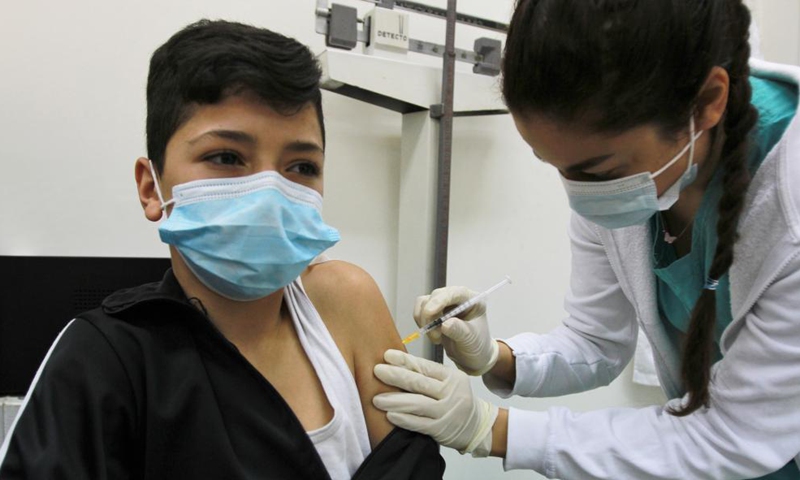 A boy receives the COVID-19 vaccine at a hospital in Tripoli, northern Lebanon, on Dec. 11, 2021.Photo:Xinhua