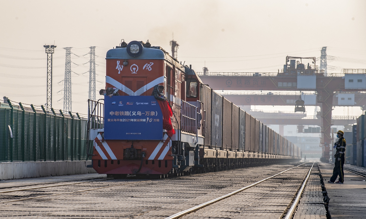 A freight train carrying potash fertilizer, home appliances, machine parts and textile products departs Yiwu, the world's small commodity hub in East China's Zhejiang on December 13, 2021. The train will arrive in the Lao capital of Vientiane after four days, the first one from Yiwu after the opening of the China-Laos Railway earlier in the month. Photo: cnsphoto
