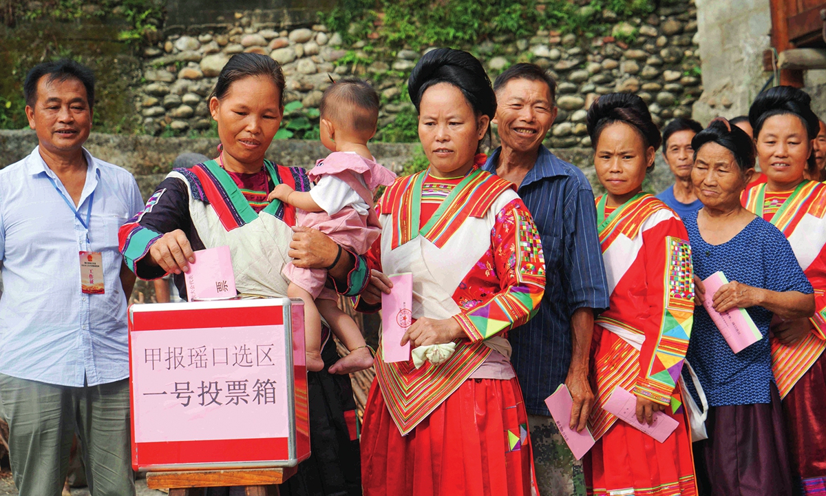 Some Yao ethic people in traditional cloths vote for deputies of the local people's congress in Liuzhou, Southwest China's Guangxi Zhuang Autonomous Region on July 22, 2021. Photo: VCG
