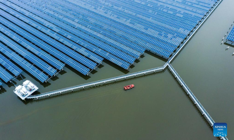 Aerial photo taken on Dec. 15, 2021 shows a 550 megawatts photovoltaic (PV) power station in Wenzhou, east China's Zhejiang Province. The PV power station in Wenzhou, covering a water area of 4.7 square kilometers, was successfully connected into the grid on Thursday. The project has combined fishery breeding and photovoltaic power generation. (Xinhua)