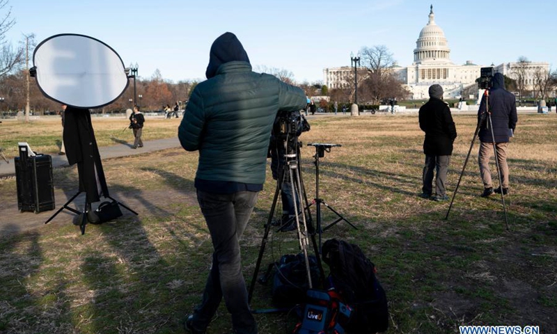 Journalists work near the U.S. Capitol building a day after supporters of U.S. President Donald Trump stormed it in Washington, D.C., the United States, Jan. 7, 2021. Photo: Xinhua