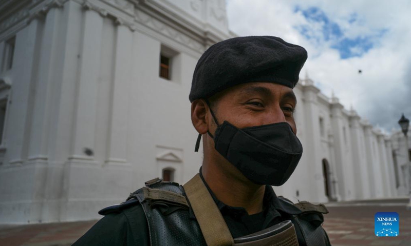 A policeman patrols near the Leon Cathedral in Leon, Nicaragua, Dec. 15, 2021. Leon, the capital of the Province of Leon, is located along the Chiquito River. Leon is also the second largest city in Nicaragua and is home to the famous Leon Cathedral.  (Xinhua)
