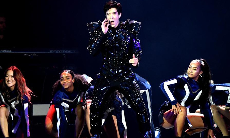 Singer Leehom Wang (Front) performs during his tour concert held at Taipei Arena in Taipei, southeast China's Taiwan, June 8, 2019. (Photo: Xinhua)