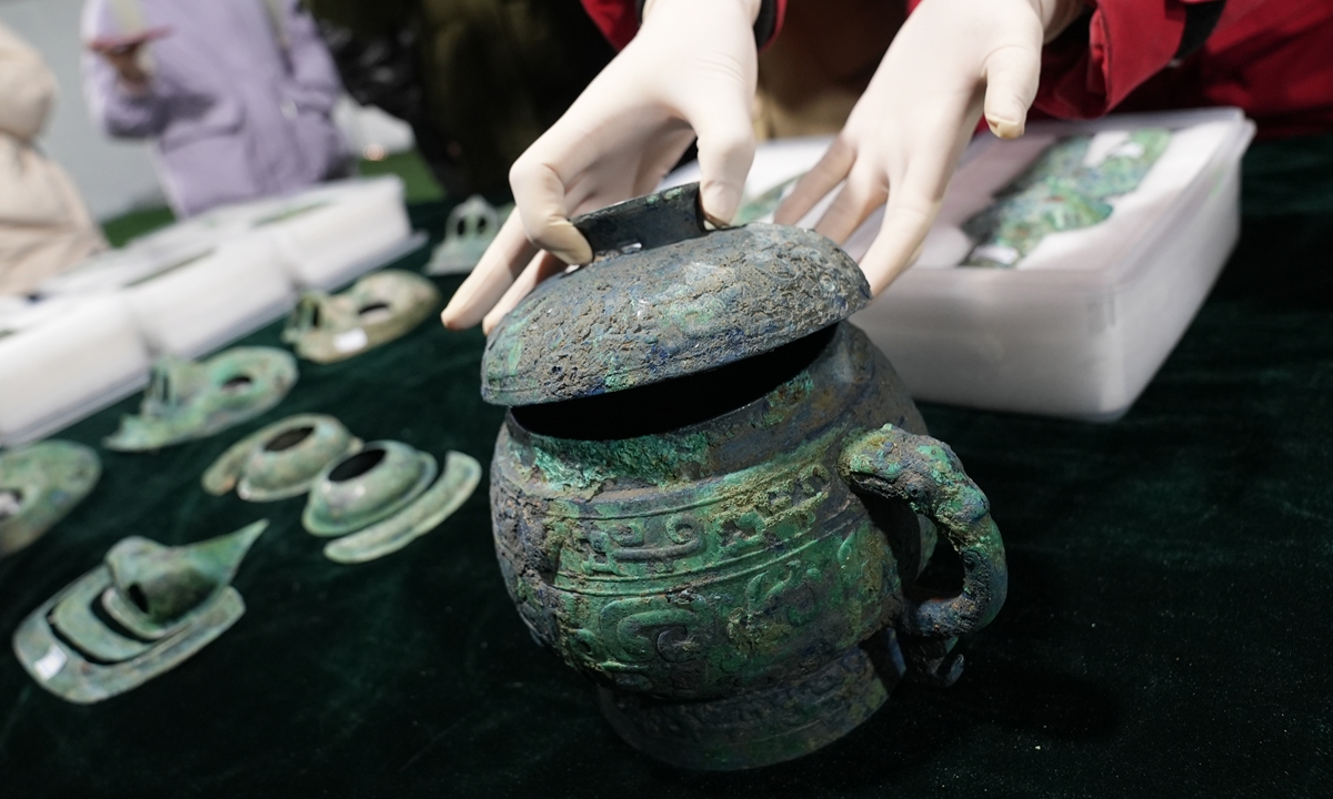 Bronze wares are unearthed in the ruins site in Beijing. Photo: VCG