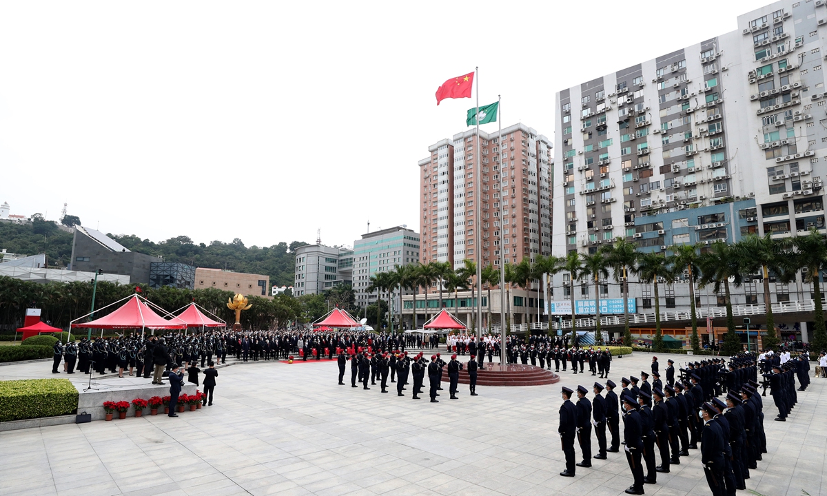 The Macao Special Administrative Region (SAR) hold a flag-raising ceremony on Monday morning marking the 22nd anniversary of Macao's return to the motherland. Photo:Ecns.cn
