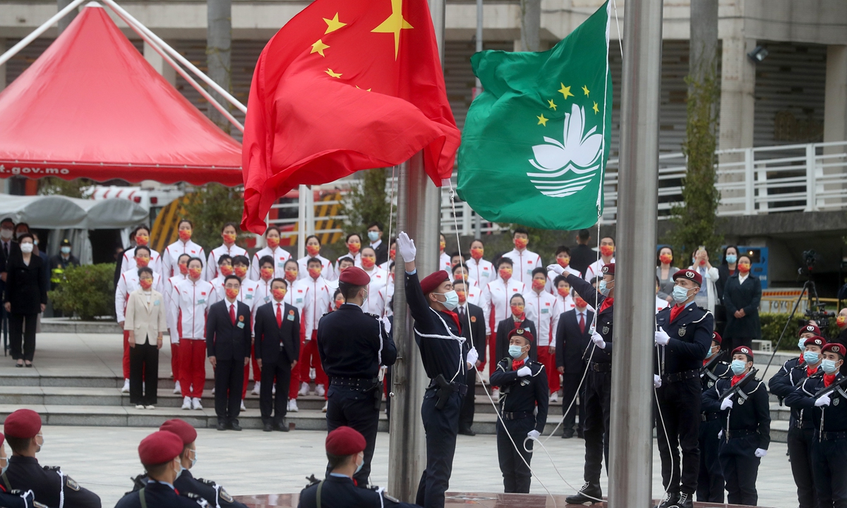 The Macao Special Administrative Region (SAR) hold a flag-raising ceremony on December 20, 2021, morning marking the 22nd anniversary of Macao's return to the motherland. Photo:VCG
