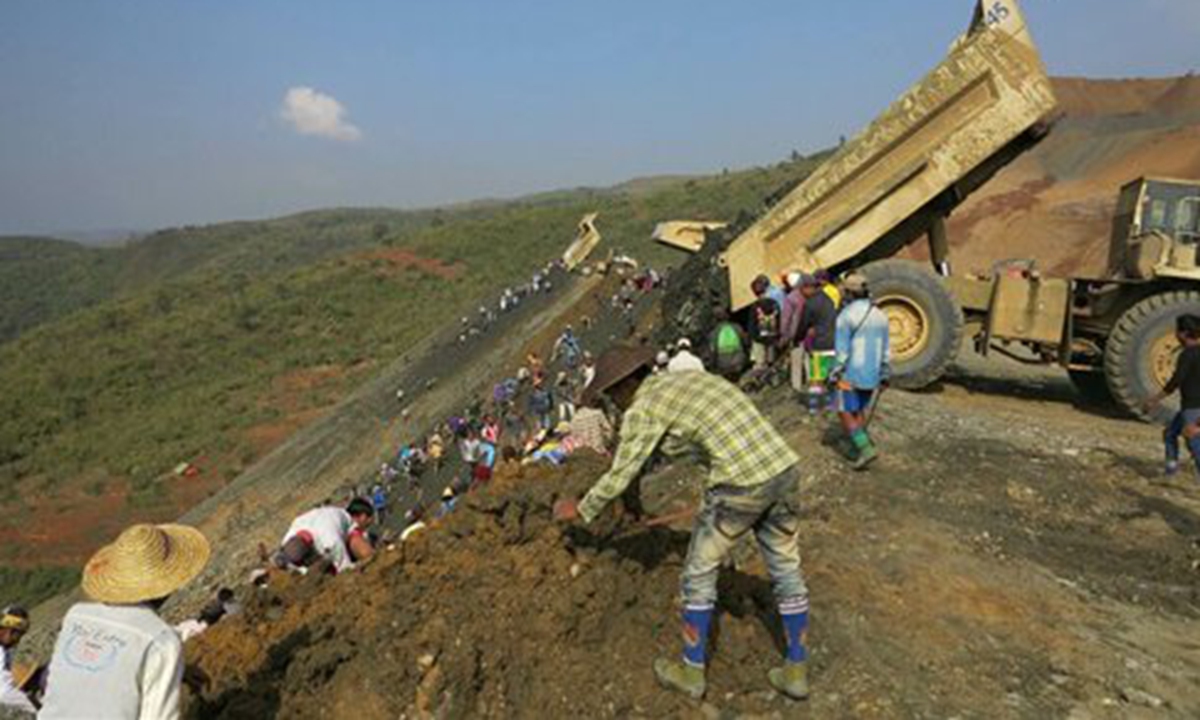 Workers are shown in Hpakant, Kachin State on Sunday near the site of a landslide in the war-torn area at the heart of Myanmar's secretive billion dollar jade industry. Rescuers in northern Myanmar on Sunday said they were confident only a handful of people are missing in a jade mine landslide. Photo: AFP