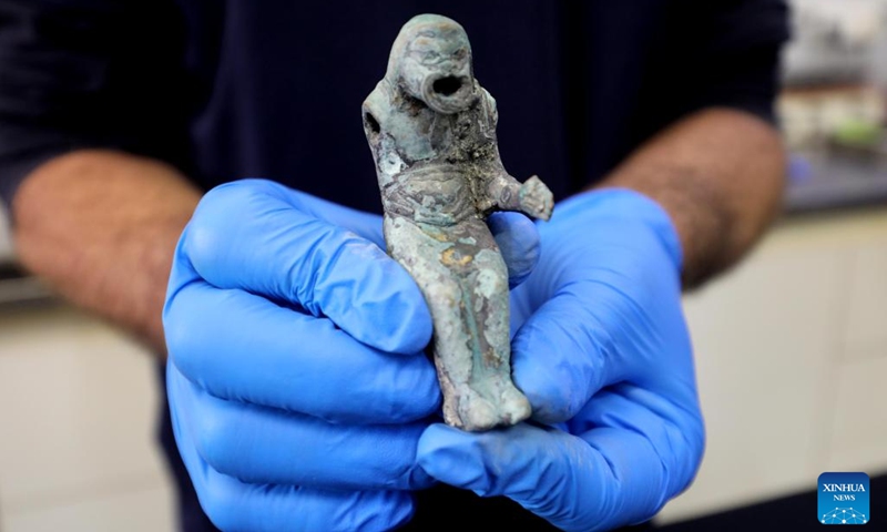 An figurine of a Roman pantomimus found from an ancient shipwreck in the Mediterranean Sea, is displayed at the Israel Antiquities Authority lab in Jerusalem on Dec. 22, 2021. Israeli marine archaeologists have found some rare treasure from two ancient shipwrecks in the Mediterranean Sea, the Israel Antiquities Authority (IAA) said on Wednesday.(Photo: Xinhua)