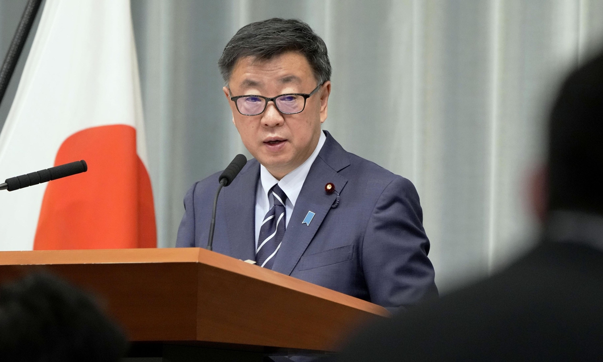 Japan's chief cabinet secretary Hirokazu Matsuno attends a press conference on December 23, 2021, during which he said US forces in Japan did not test their personnel for COVID-19 prior to their departure despite Tokyo requested so. Foreign Minister Yoshimasa Hayashi said that he had voiced 