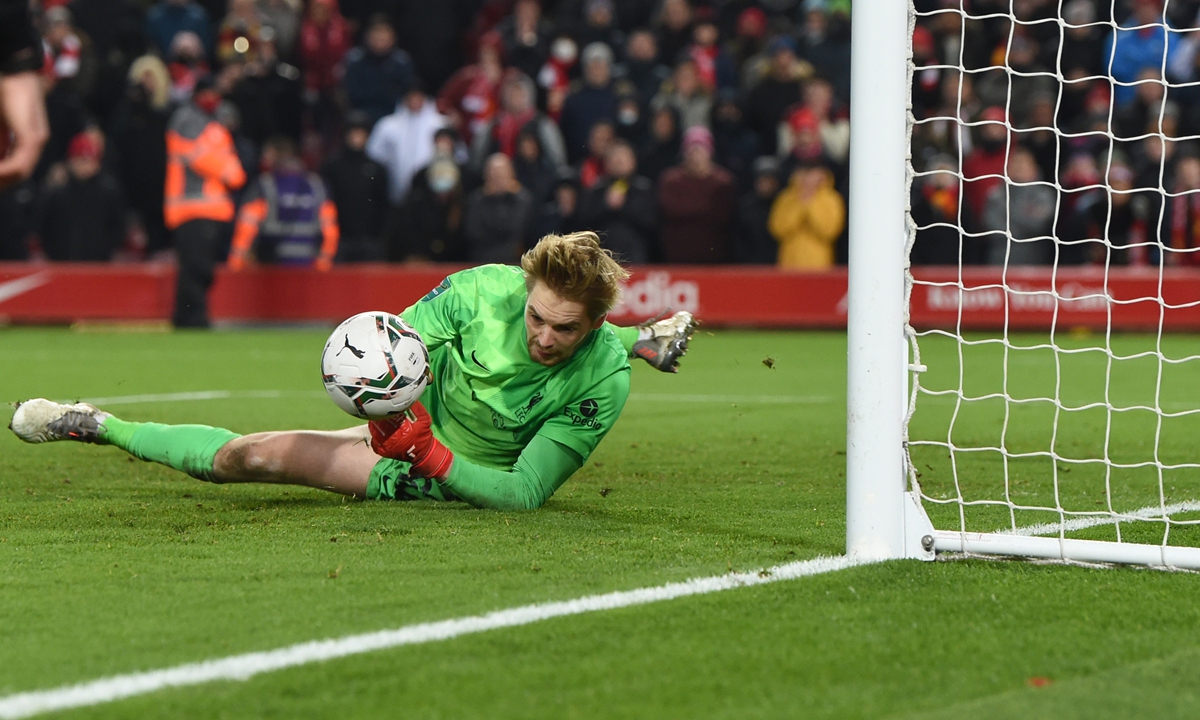 Caoimhin Kelleher of Liverpool saves a penalty in the match against Leicester City at Anfield on December 22, 2021 in Liverpool, England. Photo: VCG