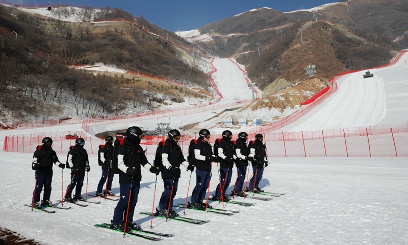 A special team of winter electricity maintenance technicians is ready for the Winter Olympic Games 2022 in Yanqing's National Alpine Skiing Centre Photo: State Grid's Winter Olympics maintenance group