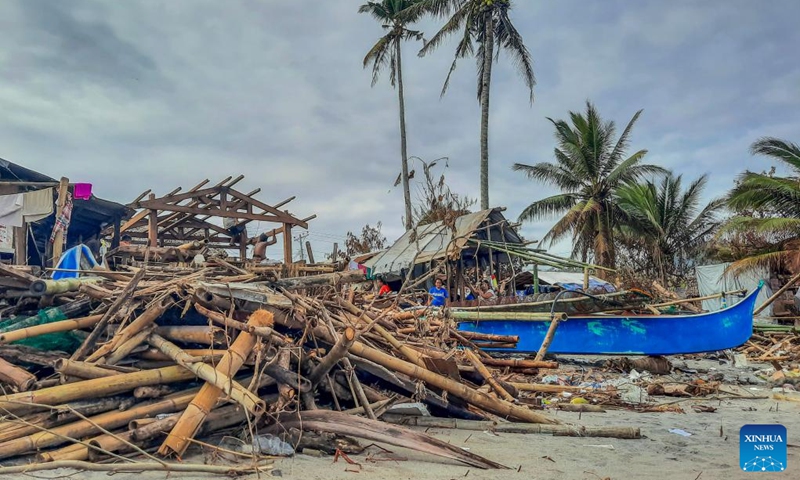 Photo shows a fishing community damaged by Typhoon Rai along a shoreline in Leyte Province, the Philippines, Dec. 22, 2021.The National Disaster Risk Reduction and Management Council (NDRRMC) reported that 156 people died from the typhoon, while the Philippine National Police reported at least 375 deaths. Many more are missing or injured.(Photo: Xinhua)