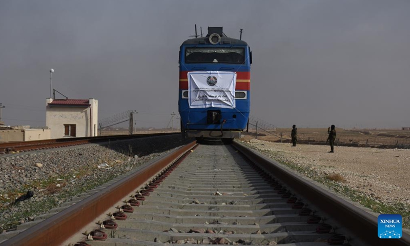 Rail wagons loaded with humanitarian aid provided by Uzbekistan arrive in Mazar-i-Sharif, Afghanistan on Dec. 23, 2021. Uzbekistan has provided 3,700 tons of humanitarian aid to war-torn Afghanistan to help needy people in the chilly winter.(Photo: Xinhua)