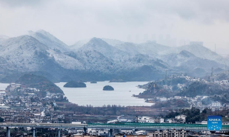 Photo taken on Dec. 26, 2021 shows the snow scenery of the Aha Lake National Wetland Park in Guiyang City, southwest China's Guizhou Province. (Xinhua/Ou Dongqu)