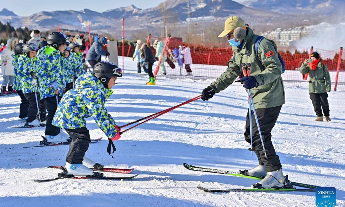 People ski at a ski resort in Qingzhou City, east China's Shandong Province, Dec. 25, 2021. (Photo by Wang Jilin/Xinhua)