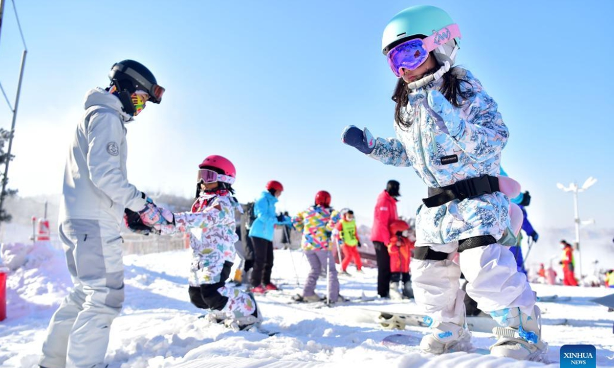 People ski at a ski resort in Qingzhou City, east China's Shandong Province, Dec. 25, 2021. (Photo by Wang Jilin/Xinhua)