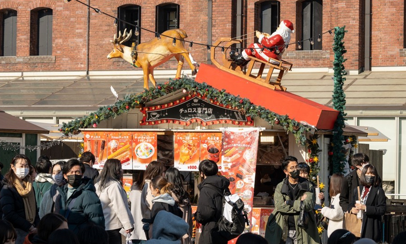 People visit a Christmas market at Yokohama Red Brick Warehouse in Yokohama, Japan, Dec. 24, 2021.Photo:Xinhua