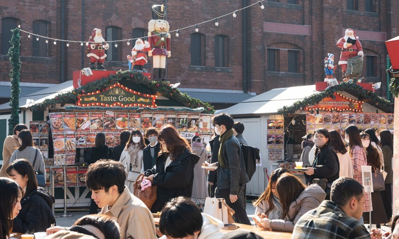 People visit a Christmas market at Yokohama Red Brick Warehouse in Yokohama, Japan, Dec. 24, 2021.Photo:Xinhua