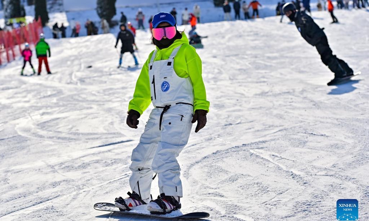 People ski at a ski resort in Qingzhou City, east China's Shandong Province, Dec. 25, 2021. (Photo by Wang Jilin/Xinhua)