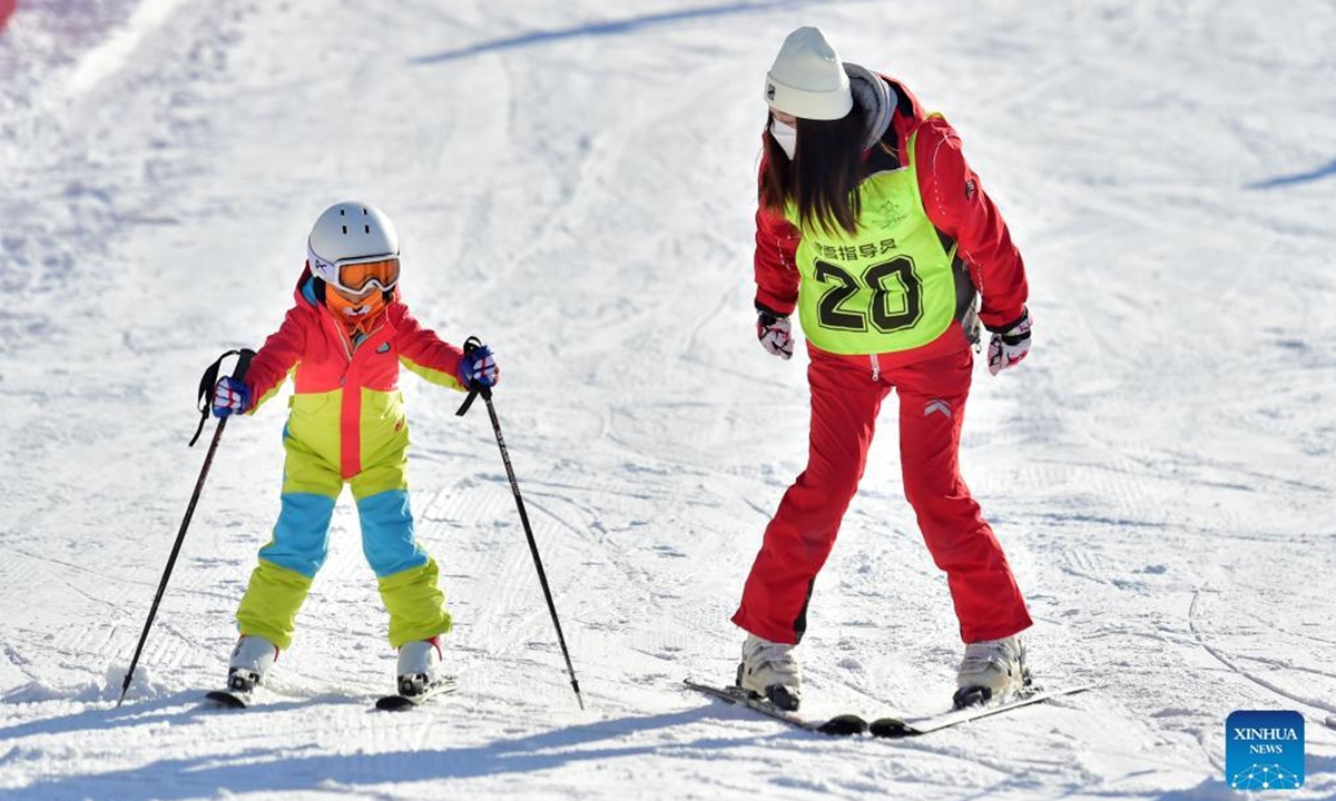 People ski at a ski resort in Qingzhou City, east China's Shandong Province, Dec. 25, 2021. (Photo by Wang Jilin/Xinhua)