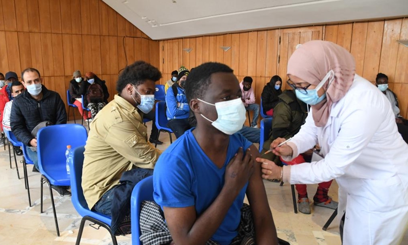 A medical staff member administers a dose of COVID-19 vaccine to a recipient at a vaccination station during a national COVID-19 vaccination operation in Tunis, Tunisia, on Dec. 25, 2021.Photo:Xinhua
