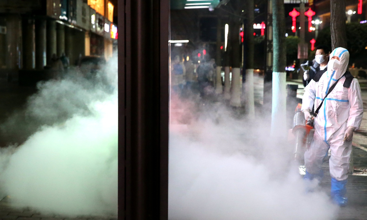 Staff roll out city-wide disinfection in epidemic-hit Xi'an, Northwest China's Shaanxi Province, on December 26, 2021. Photo: VCG 