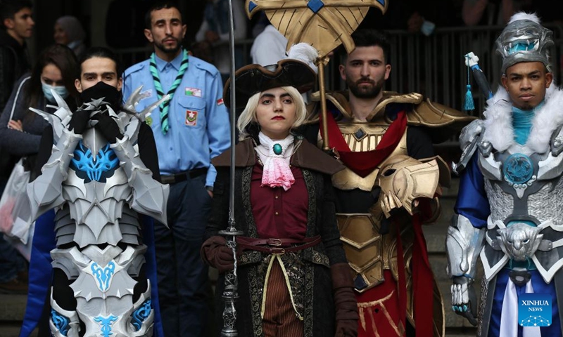 Performers in comic costumes pose for photos during the 13th Comic Strip International Festival in Algiers, Algeria, on Dec. 26, 2021.Photo:Xinhua