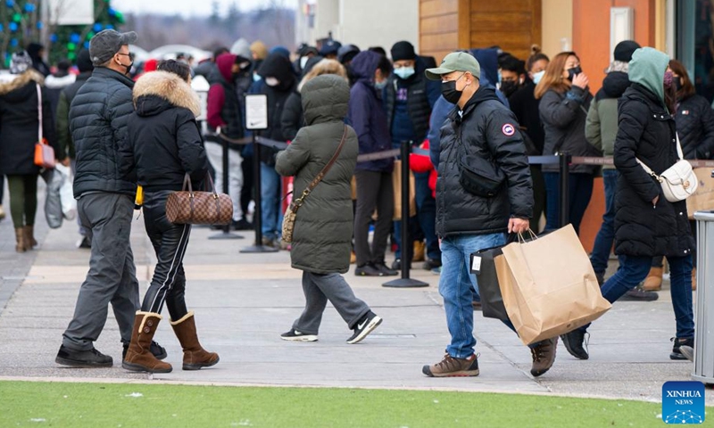 People do shopping at an outlet mall during Boxing Day sales in Halton Hills, Ontario, Canada, on Dec. 26, 2021.Photo:Xinhua