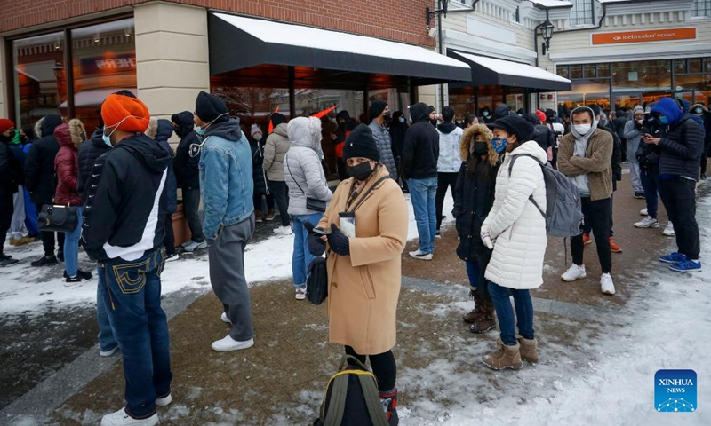 People line up to enter a store at an outlet mall during Boxing Day sales in Halton Hills, Ontario, Canada, on Dec. 26, 2021.Photo:Xinhua