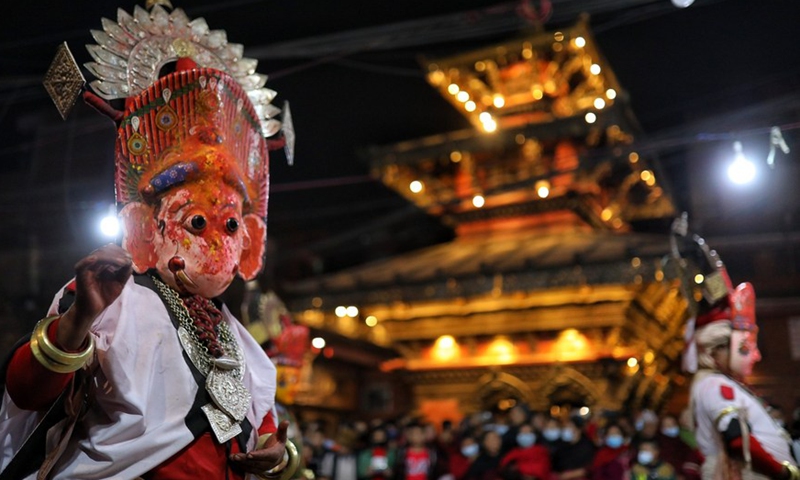 A masked man performs during the Navadurga Festival in Bhaktapur, Nepal, on Dec. 25, 2021.Photo:Xinhua