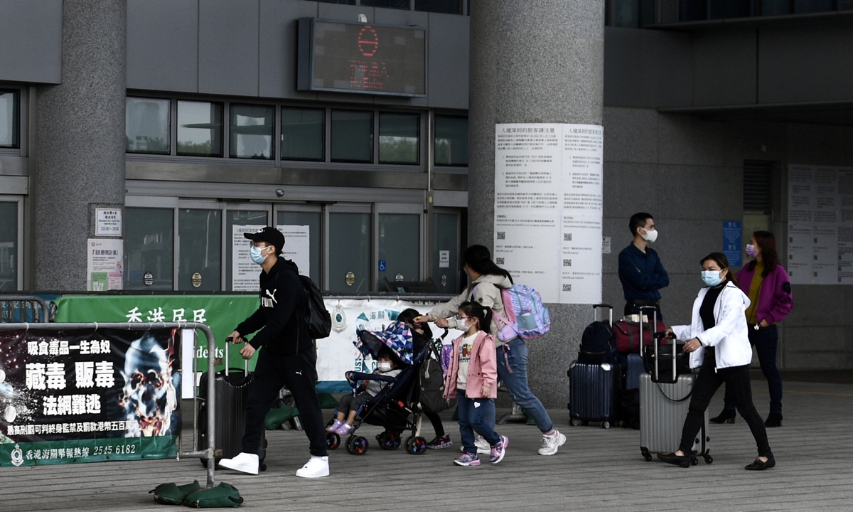 People from Hong Kong arrive at the Shenzhen Bay Port on March 22, 2021. Photo: VCG