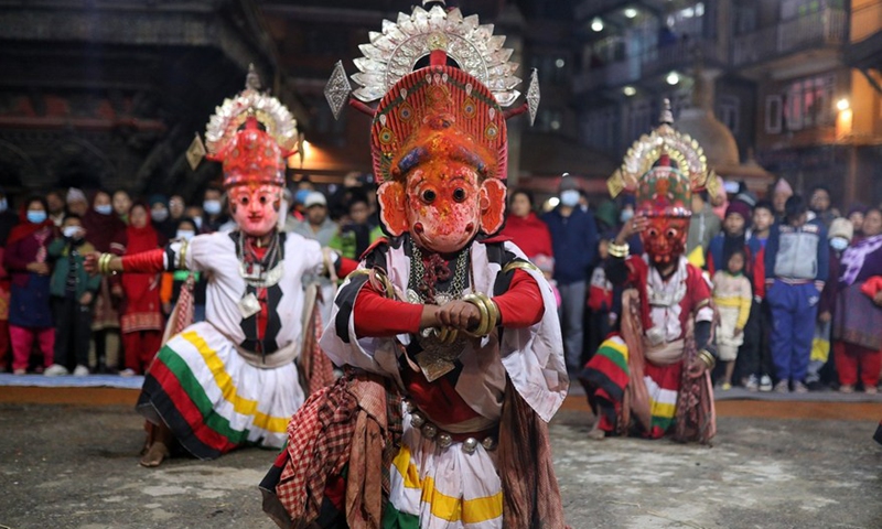 Masked men perform during the Navadurga Festival in Bhaktapur, Nepal, on Dec. 25, 2021.Photo:Xinhua