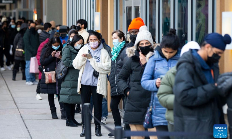 People line up to enter a store at an outlet mall during Boxing Day sales in Halton Hills, Ontario, Canada, on Dec. 26, 2021.Photo:Xinhua