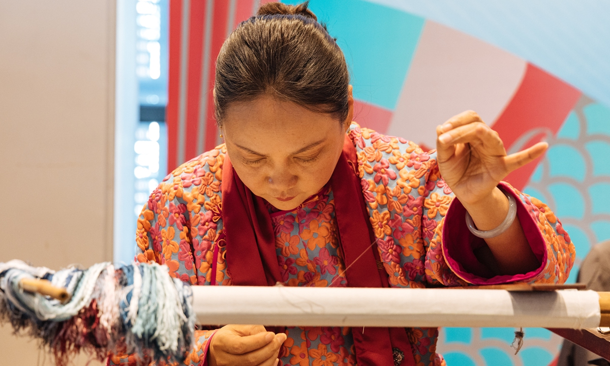 Promotional material for the Meet in Beijing International Arts Festival Photo: Courtesy of China Arts and Entertainment Group  A cultural inheritor demonstrates traditional Chinese embroidery at the press conference in Beijing on December 27, 2021. Photo: Li Hao/GT