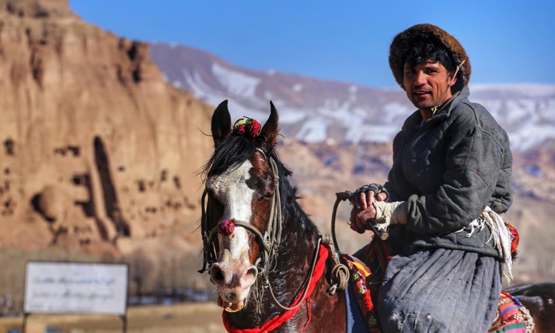 A horse rider poses for photos during a game of Buzkashi, or goat grabbing in English, in Bamiyan, Afghanistan, Dec. 28, 2021. (Photo by Ahmadi/Xinhua)