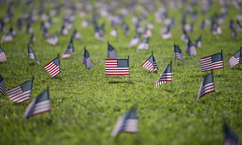 U.S. national flags representing the 200,000 lives lost to COVID-19 in the United States are placed on the National Mall in Washington, D.C., the United States, on Sep 22, 2020.Photo:Xinhua