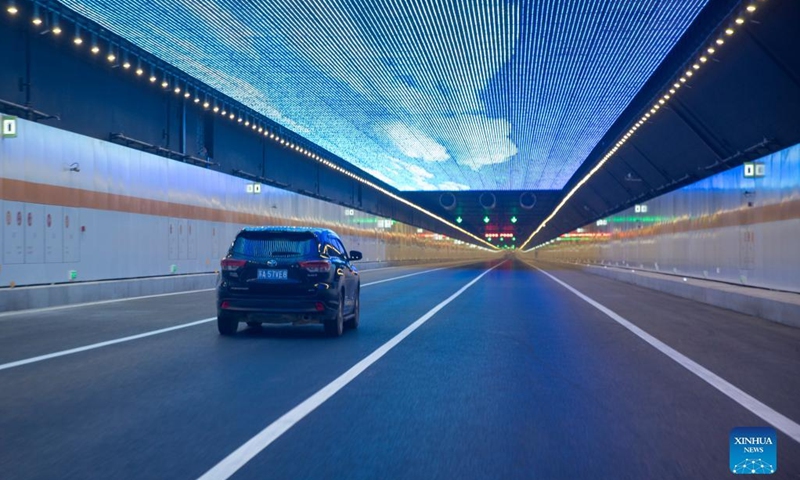 A vehicle runs inside the Taihu tunnel in east China's Jiangsu Province, Dec. 30, 2021.Photo:Xinhua