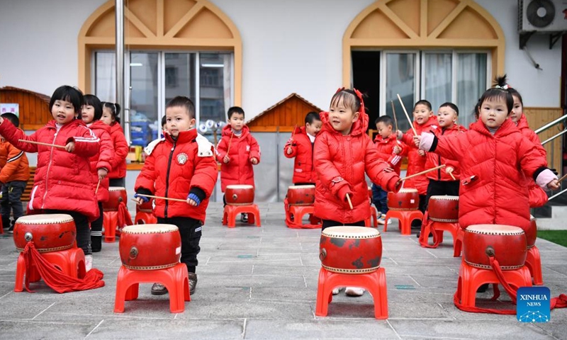 Children perform drum at a kindergarten in Yuqing County of Zunyi, southwest China's Guizhou Province, Dec. 31, 2021.Photo:Xinhua