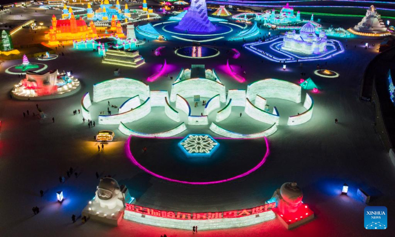 Aerial photo taken on Jan. 2, 2022 shows tourists visiting the Harbin Ice-Snow World in Harbin, northeast China's Heilongjiang Province. Harbin, famous for its ice and snow tourism, attracts tourists during the winter time. (Xinhua/Zhang Tao)