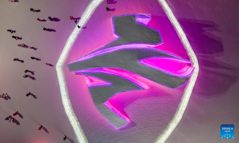 Aerial photo taken on Jan. 2, 2022 shows tourists visiting the Harbin Ice-Snow World in Harbin, northeast China's Heilongjiang Province. Harbin, famous for its ice and snow tourism, attracts tourists during the winter time. (Xinhua/Zhang Tao)