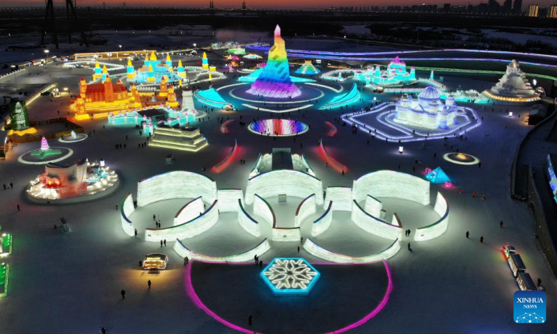 Aerial photo taken on Jan. 2, 2022 shows tourists visiting the Harbin Ice-Snow World in Harbin, northeast China's Heilongjiang Province. Harbin, famous for its ice and snow tourism, attracts tourists during the winter time. (Xinhua/Zhang Tao)