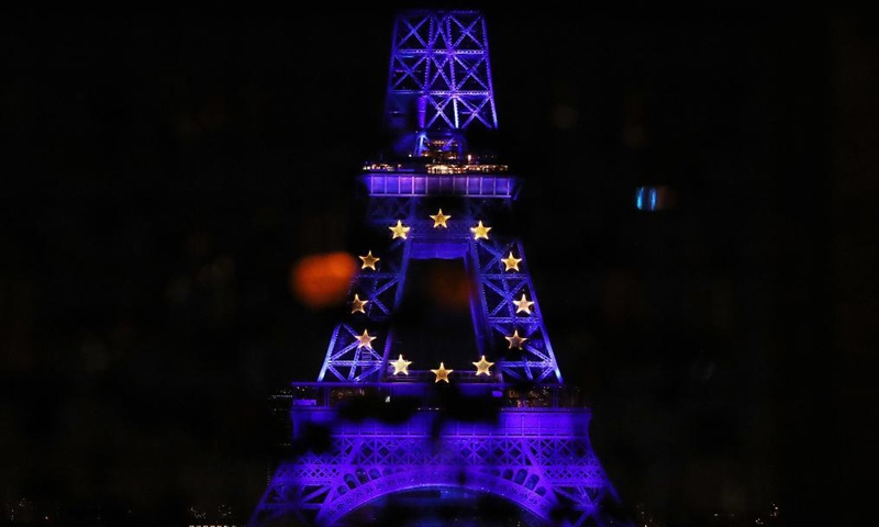 The Eiffel Tower is lit up in blue to celebrate the start of the French presidency of the European Union in Paris, France, Jan. 1, 2022. The most emblematic landmarks in France turned blue Saturday night to mark French presidency of the EU. (Xinhua/Gao Jing)