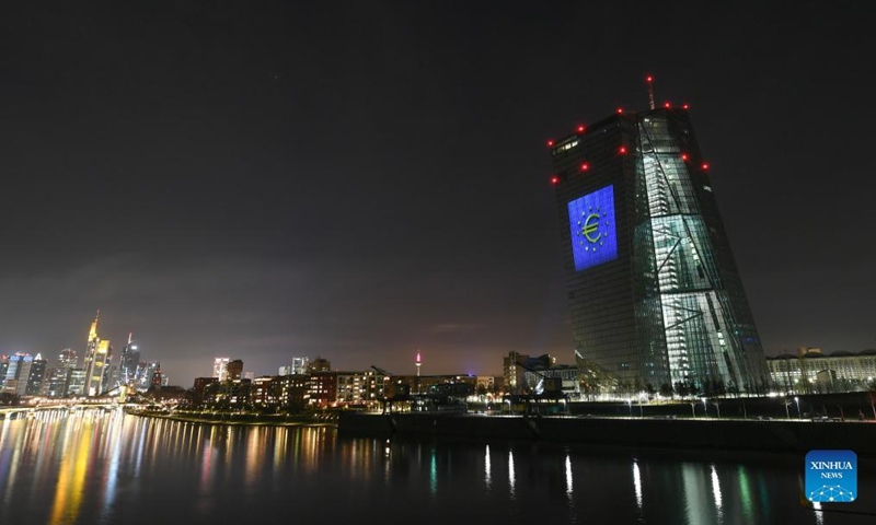 Photo taken on Jan. 1, 2022 shows the headquarters of the European Central Bank illuminated to celebrate the 20th anniversary of Euro banknotes and coins in Frankfurt, Germany. (Xinhua/Lu Yang)