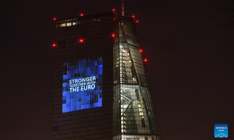 Photo taken on Jan. 1, 2022 shows the headquarters of the European Central Bank illuminated to celebrate the 20th anniversary of Euro banknotes and coins in Frankfurt, Germany. (Xinhua/Lu Yang)