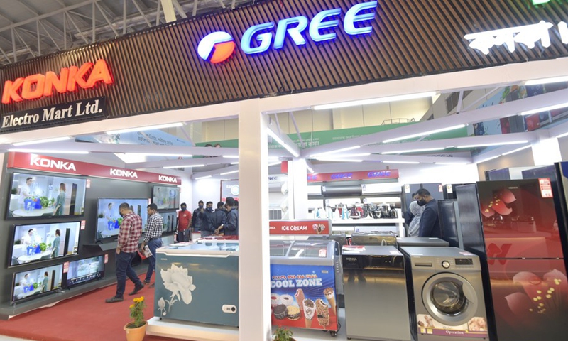 Visitors look at appliances at a booth during the Dhaka International Trade Fair in Purbachal on the outskirts of Dhaka, Bangladesh, on Jan. 2, 2022.Photo:Xinhua