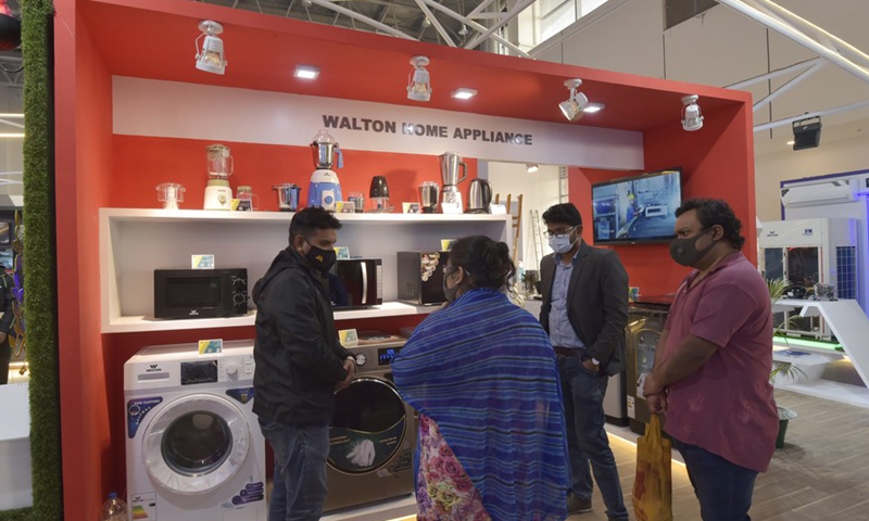 Visitors look at appliances at a booth during the Dhaka International Trade Fair in Purbachal on the outskirts of Dhaka, Bangladesh, on Jan. 2, 2022.Photo:Xinhua