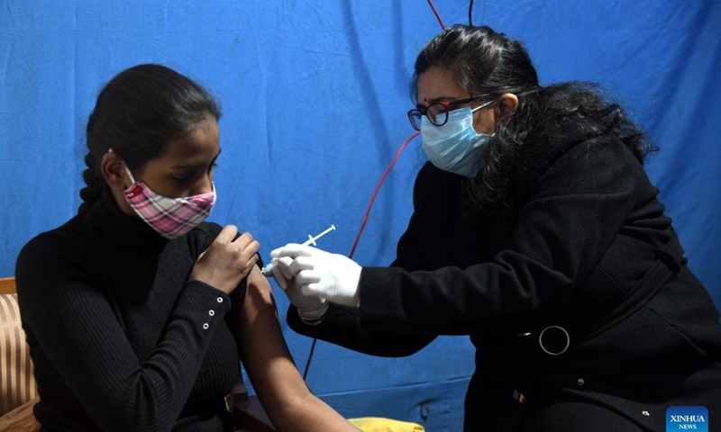 A girl receives a dose of COVID-19 vaccine in New Delhi, India, Jan. 3, 2022.Photo:Xinhua